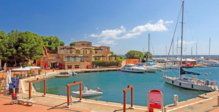 Berthed yachts in the pretty port of Portisco