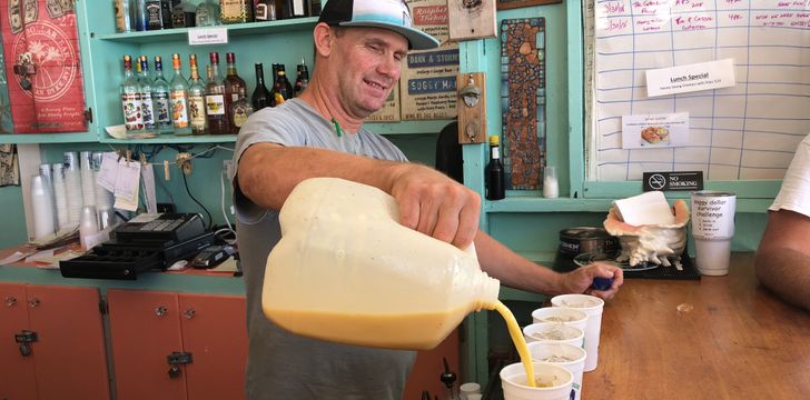 Pouring a Painkiller drink on a charter at Soggy Dollar Bar,Jost Van Dyke BVI