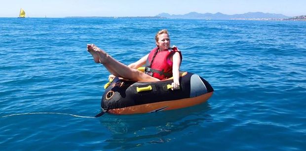 Charlotte sitting in the donut before being towed behind the boat.