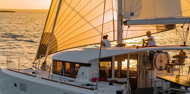 Sail off into the sunset on your catamaran charter with Boatbookings.com