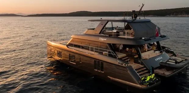 Rear view of AMBER ONE cruising across Adriatic waters during a sunset