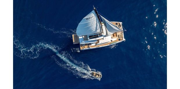 FARBEN aerial shot with full sails and tender