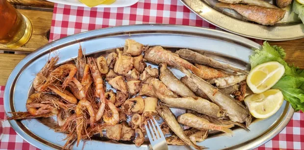 freshly fried shrimp, squid, and small fish served at a restaurant in Split along Croatia’s coast