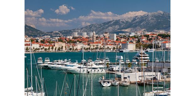 Split harbor with yachts and view of old town in background