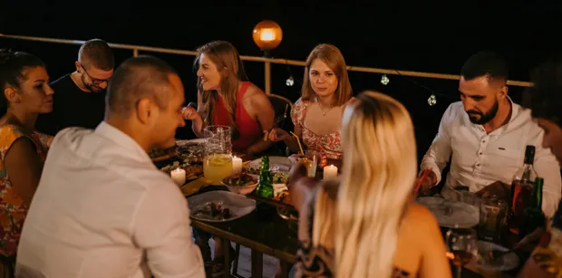restaurant at night in croatia with courtyard seating and a group of cheerful diners