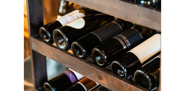 croatian wine bottles on the shelf, a must try during a stop in split during your yacht charter