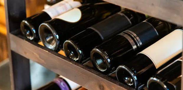 croatian wine bottles on the shelf, a must try during a stop in split during your yacht charter