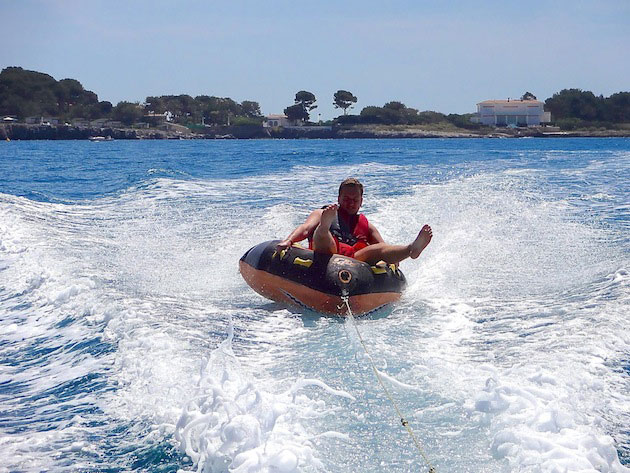 Race along behind your boat on an inflatable donut