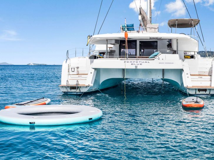 PERPETUAL BLUE Fountaine Pajot 59 - anchored aft view with water toys PERPETUAL BLUE Fountaine Pajot 59 - anchored aft view with water toys