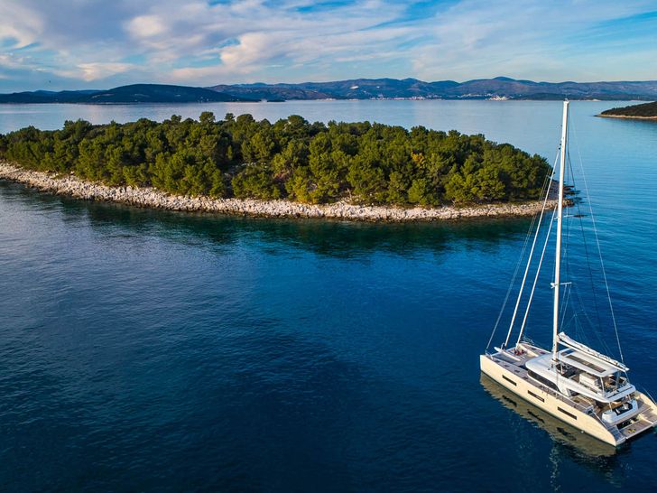 AMADA MIA Lagoon 65 - anchored near an island AMADA MIA Lagoon 65 - anchored near an island