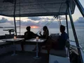 SUN DAZE Bali 5.4 - guests enjoying the sunset on the flybridge SUN DAZE Bali 5.4 - guests enjoying the sunset on the flybridge