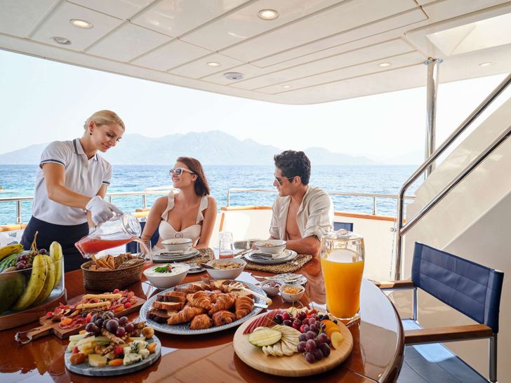 ESTIA POSEIDON Falcon 85 - guests dining alfresco ESTIA POSEIDON Falcon 85 - guests dining alfresco