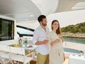 MYNE Azimut S8 - guests enjoying the view with a wine MYNE Azimut S8 - guests enjoying the view with a wine
