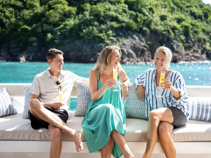 LA VIE EST BELLE Bali 5.4 - guests seated on the aft LA VIE EST BELLE Bali 5.4 - guests seated on the aft