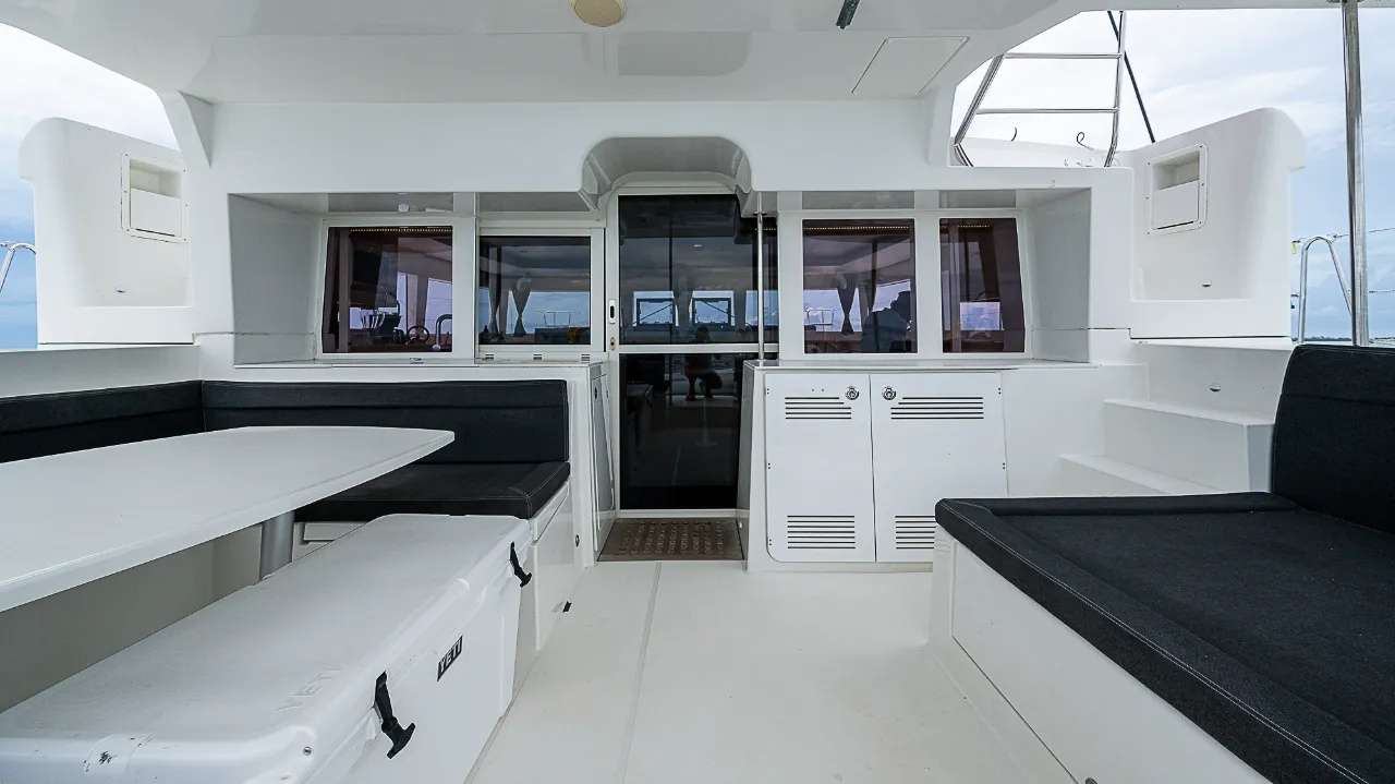 SOMEWHERE Lagoon 450F - aft deck alfresco dining area