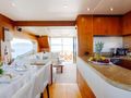 GRACE XI Sunseeker 75 - dining area and galley GRACE XI Sunseeker 75 - dining area and galley