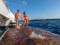 CHRISTAL MIO 80 Fountaine Pajot Thira 80 - guests enjoying the hydraulic swim platform CHRISTAL MIO 80 Fountaine Pajot Thira 80 - guests enjoying the hydraulic swim platform