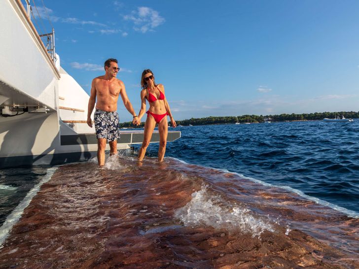 CHRISTAL MIO 80 Fountaine Pajot Thira 80 - guests enjoying the hydraulic swim platform CHRISTAL MIO 80 Fountaine Pajot Thira 80 - guests enjoying the hydraulic swim platform