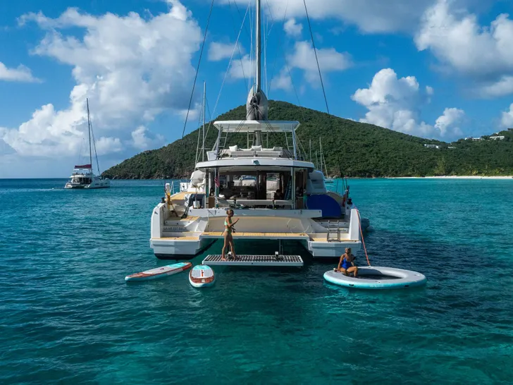 LUNAR ARC Bali 5.4 - anchored aft shot with the water toys LUNAR ARC Bali 5.4 - anchored aft shot with the water toys