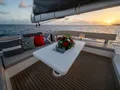 CHANGES IN LATITUDES Leopard 50 - flybridge lounge with table CHANGES IN LATITUDES Leopard 50 - flybridge lounge with table