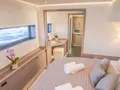 ARIVA Fountaine Pajot Power 67 - master cabin bed and working corner ARIVA Fountaine Pajot Power 67 - master cabin bed and working corner