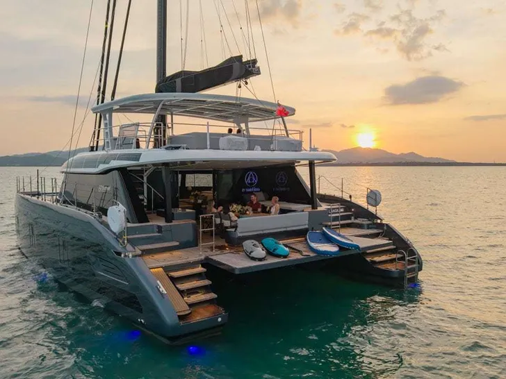 E-MOTION Sunreef 60 Eco - anchored aft shot under the sunset E-MOTION Sunreef 60 Eco - anchored aft shot under the sunset