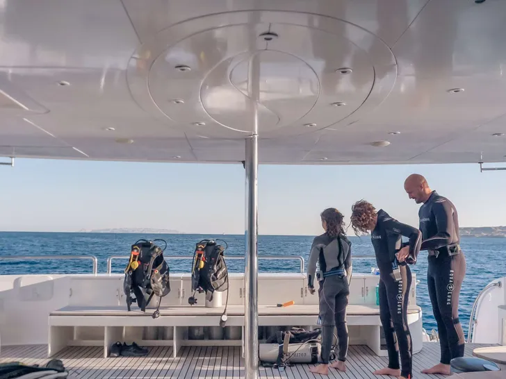 SEVEN SPICES 39-meter Custom Aluminum Cutter - scuba diving preparation on the aft deck SEVEN SPICES 39-meter Custom Aluminum Cutter - scuba diving preparation on the aft deck