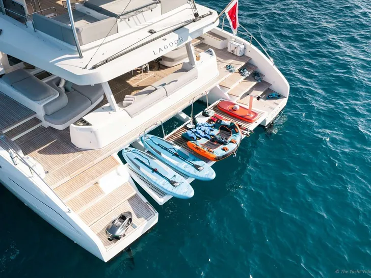 REVA NUI Lagoon Seventy 7 - aft shot with the water toys REVA NUI Lagoon Seventy 7 - aft shot with the water toys