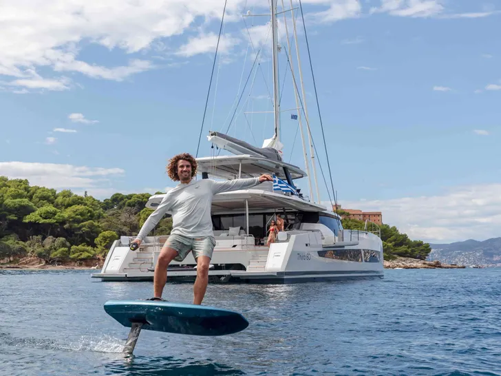 MAGIC MOMENTS 3 Fountaine Pajot Thira 80 - anchored while e-Foiling MAGIC MOMENTS 3 Fountaine Pajot Thira 80 - anchored while e-Foiling