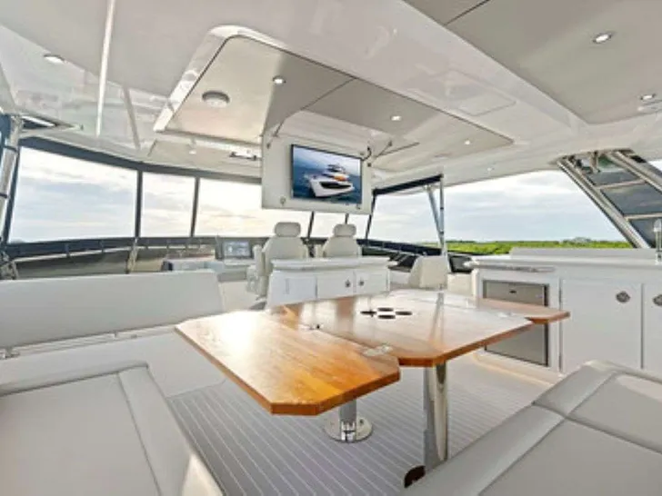 TREASURED C’s Aquila 50 - flybridge dining lounge TREASURED C’s Aquila 50 - flybridge dining lounge