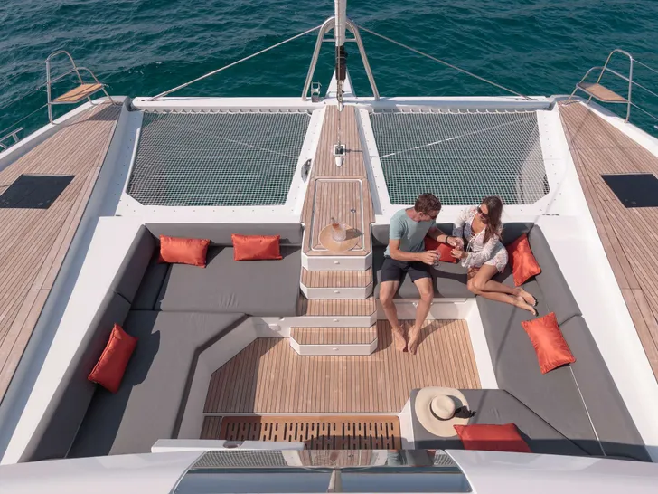 NEHALENNIA Fountaine Pajot Samana - foredeck aerial view with guests relaxing NEHALENNIA Fountaine Pajot Samana - foredeck aerial view with guests relaxing