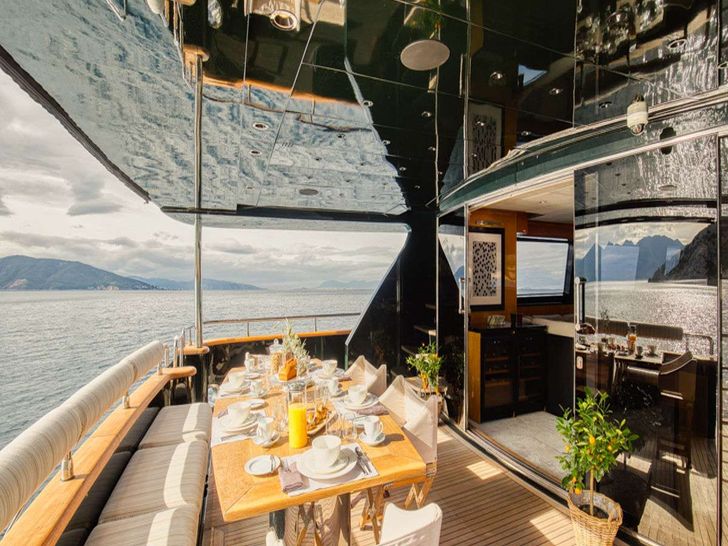 CAN'T REMEMBER Tecnomar 35m - main aft deck alfresco dining set up CAN'T REMEMBER Tecnomar 35m - main aft deck alfresco dining set up