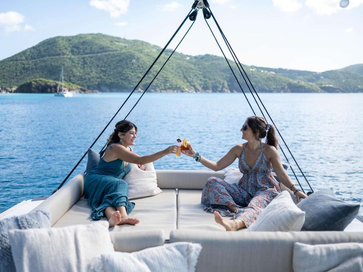 ISLAND STANDARD TIME Bali 4.8 - guests on the flybridge sunbathing area ISLAND STANDARD TIME Bali 4.8 - guests on the flybridge sunbathing area