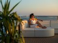 ALFA MARIO Custom 52m - guest lounging under the sunset ALFA MARIO Custom 52m - guest lounging under the sunset