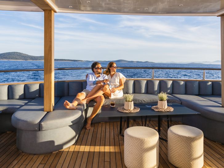 BELLA Custom 48m - guests on the sundeck lounge BELLA Custom 48m - guests on the sundeck lounge