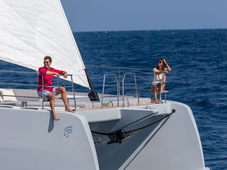 SERENISSIMA III Fountaine Pajot 80 - guests on the bow SERENISSIMA III Fountaine Pajot 80 - guests on the bow