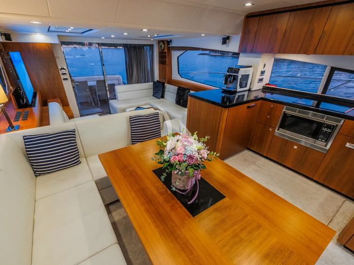 2 DRUNK Sunseeker Manhattan 63 - saloon dining area and galley 2 DRUNK Sunseeker Manhattan 63 - saloon dining area and galley