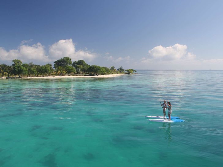 Dreaming On - Paddleboarding at Moho Caye Dreaming On - Paddleboarding at Moho Caye