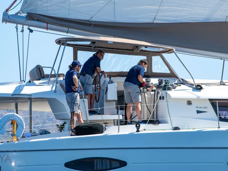 HIGHJINKS Fountaine Pajot Sanya 57 - guests moving up to the flybridge HIGHJINKS Fountaine Pajot Sanya 57 - guests moving up to the flybridge