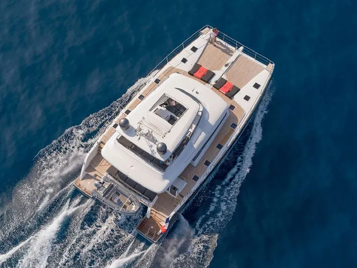 CUTE LITTLE CAT Lagoon 630 - top aerial shot cruising CUTE LITTLE CAT Lagoon 630 - top aerial shot cruising