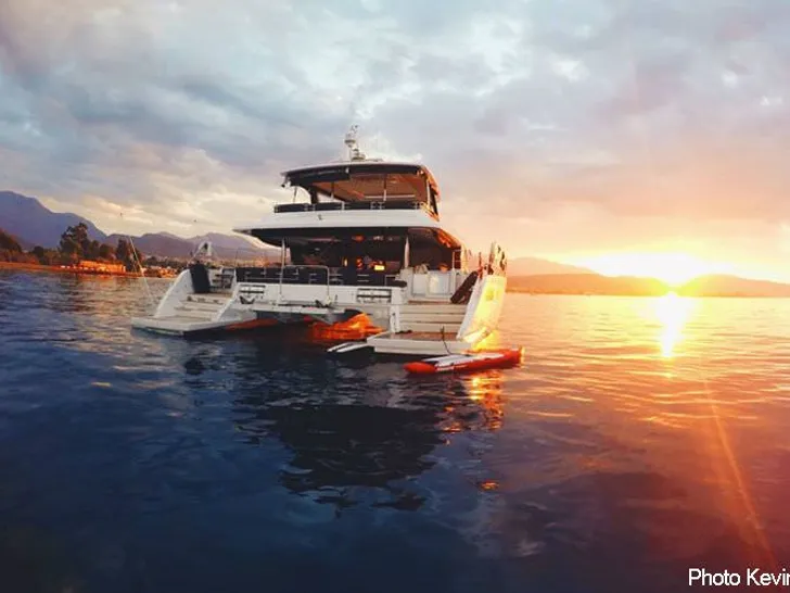 CUTE LITTLE CAT Lagoon 630 - aft shot anchored under the sunset CUTE LITTLE CAT Lagoon 630 - aft shot anchored under the sunset