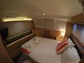 BAGHEERA Lagoon 620 Queen size cabin with walk around bed.. Bed faces full size window.
