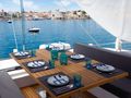FEEL THE BLUE Sunreef 60 - aft deck alfresco dining set up FEEL THE BLUE Sunreef 60 - aft deck alfresco dining set up