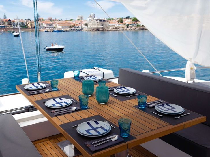 FEEL THE BLUE Sunreef 60 - aft deck alfresco dining set up FEEL THE BLUE Sunreef 60 - aft deck alfresco dining set up