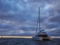 FEEL THE BLUE Sunreef 60 - aft shot under the sunset FEEL THE BLUE Sunreef 60 - aft shot under the sunset
