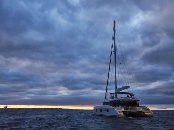 FEEL THE BLUE Sunreef 60 - aft shot under the sunset FEEL THE BLUE Sunreef 60 - aft shot under the sunset