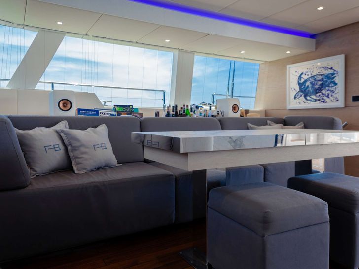 FEEL THE BLUE Sunreef 60 - saloon dining area FEEL THE BLUE Sunreef 60 - saloon dining area