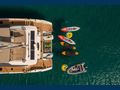 AETHER Fountaine Pajot Alegria 67 - aft aerial shot with water toys