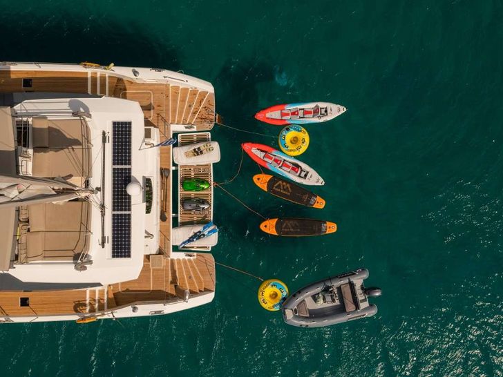 AETHER Fountaine Pajot Alegria 67 - aft aerial shot with water toys AETHER Fountaine Pajot Alegria 67 - aft aerial shot with water toys