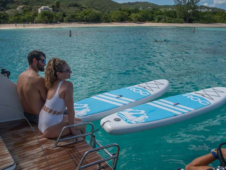 KARMA Lagoon 50 - guests on the swim platform with the paddleboards KARMA Lagoon 50 - guests on the swim platform with the paddleboards